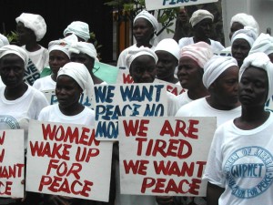 Liberian women demonstrate at the American Embassy in Monrovia at the height of the civil war, 2003.
